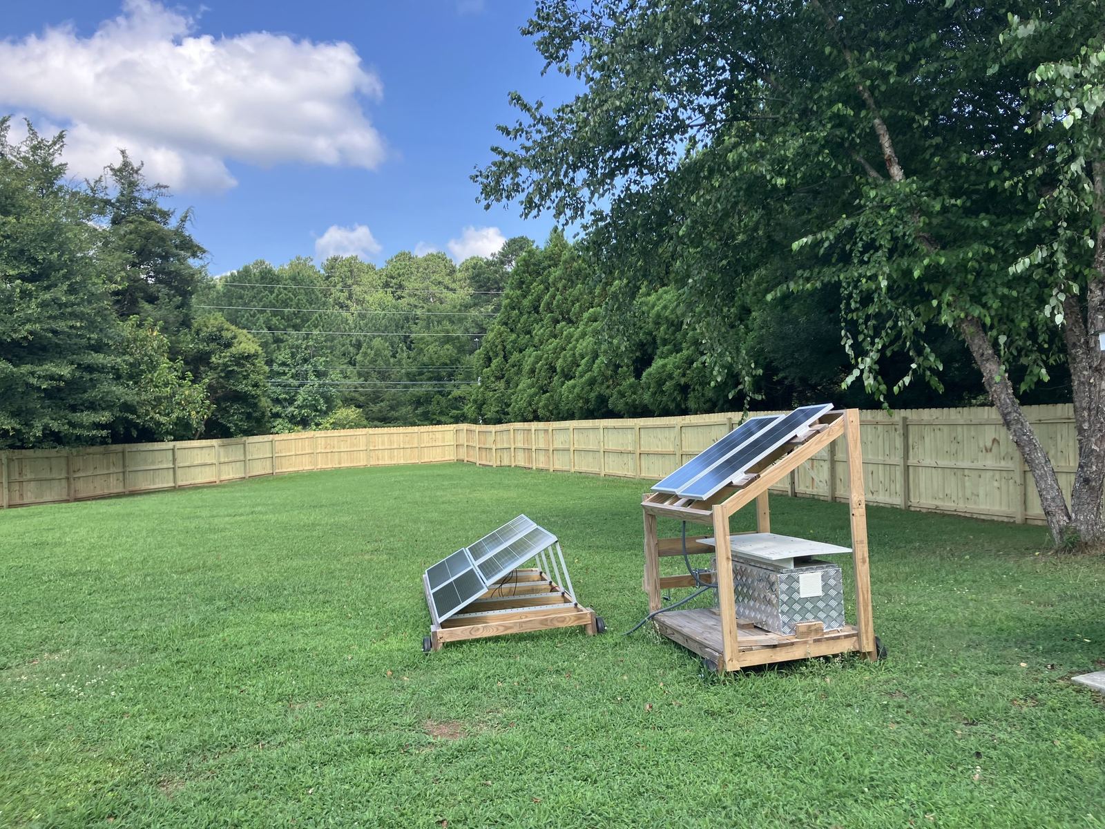 Pressure-treated wood fence with solid posts
