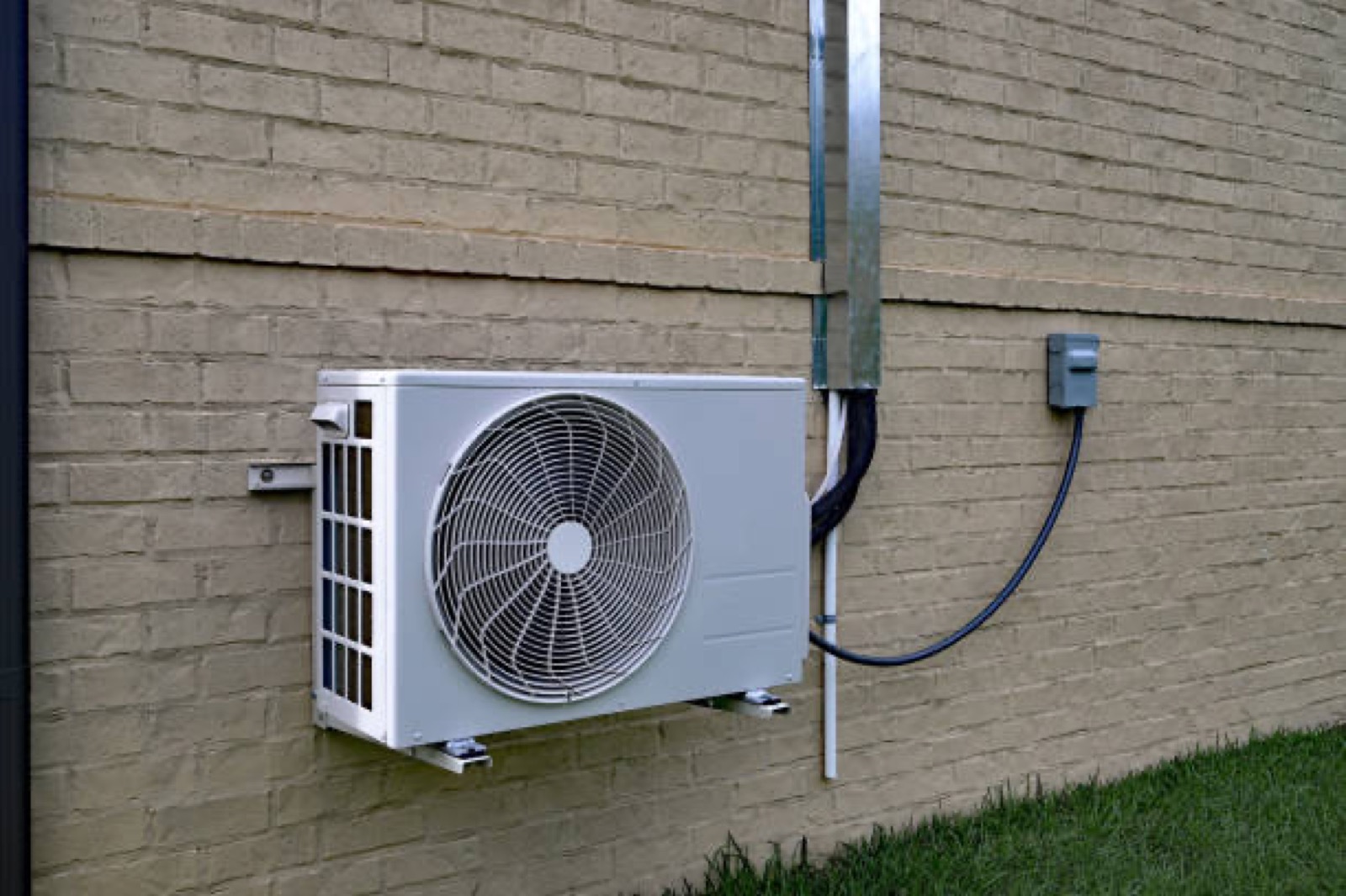 Ductless mini split system installed on a home exterior